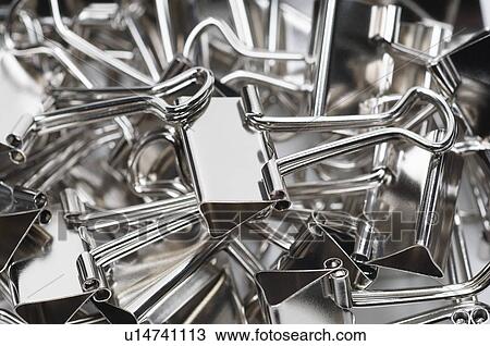 Heap of binder clips, close-up View Large Photo Image Stock Image - Heap of binder clips, close-up. Fotosearch