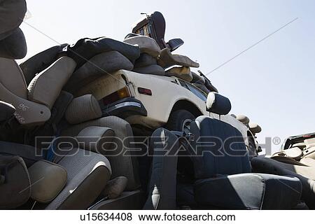Heap of car seats in junkyard View Large Photo Image Stock Photo - Heap of car seats in junkyard. Fotosearch