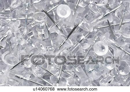 Stock Photo - Heap of transparent thumbtacks. Fotosearch