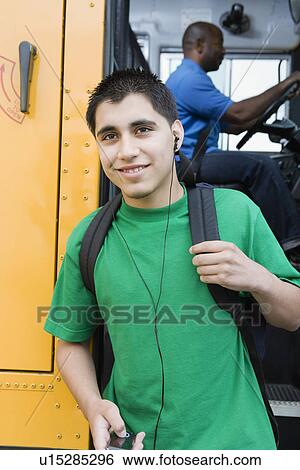 High School Boy With MP3 Player Getting Off School Bus View Large Photo Image Stock Photograph - High School Boy With MP3 Player Getting Off School Bus. Fotosearch