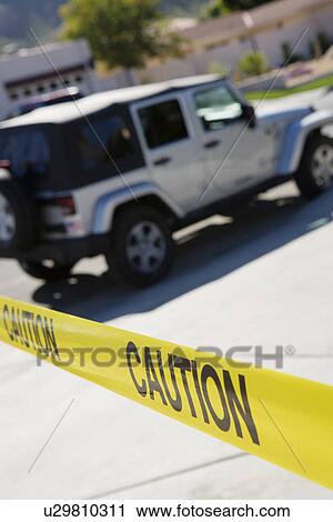 Stock Image - Jeep Behind Police Tape. Fotosearch