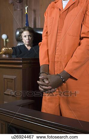 Judge convicting criminal in court View Large Photo Image Stock Photo - Judge convicting criminal in court. Fotosearch
