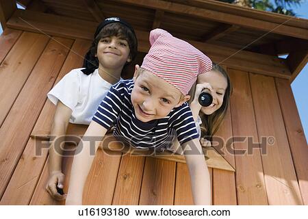 Kids Playing in Playhouse View Large Photo Image Stock Image - Kids Playing in Playhouse. Fotosearch