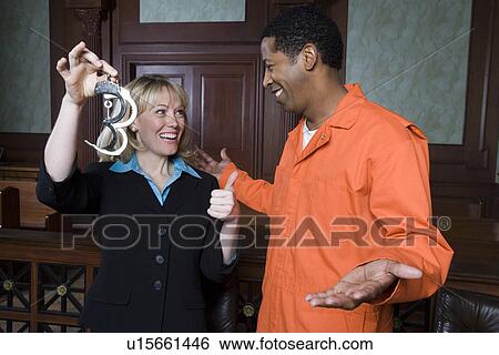 Stock Photograph - Lawyer and client celebrating in court. Fotosearch