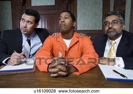 Stock Photo - Lawyers with criminal in court. Fotosearch