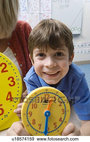 Little Boy Learning to Tell Time View Large Photo Image Stock Photo - Little Boy Learning to Tell Time. Fotosearch