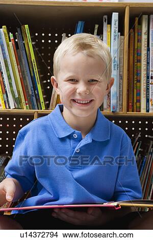 Little Boy Reading a Book View Large Photo Image Picture - Little Boy Reading a Book. Fotosearch