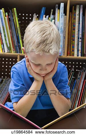 Picture - Little Boy Reading a Book. Fotosearch