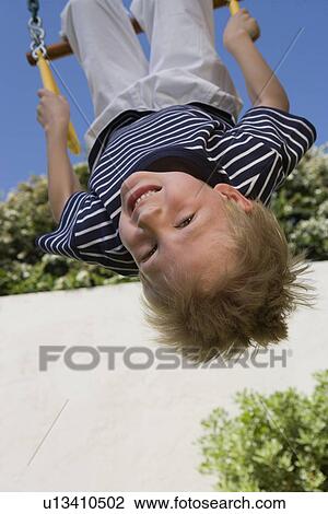 Little Boy Upside Down on a Swing View Large Photo Image Stock Image - Little Boy Upside Down on a Swing. Fotosearch