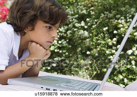 Stock Photo - Little Boy Using a Laptop. Fotosearch