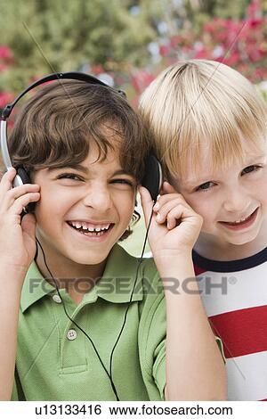 Little Boys Listening to Headphones View Large Photo Image Stock Photograph - Little Boys Listening to Headphones. Fotosearch