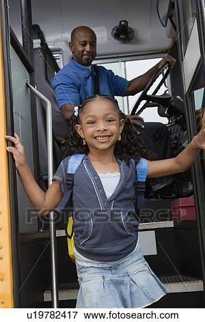 Little Girl Getting off of Schoolbus View Large Photo Image Stock Photo - Little Girl Getting off of Schoolbus. Fotosearch