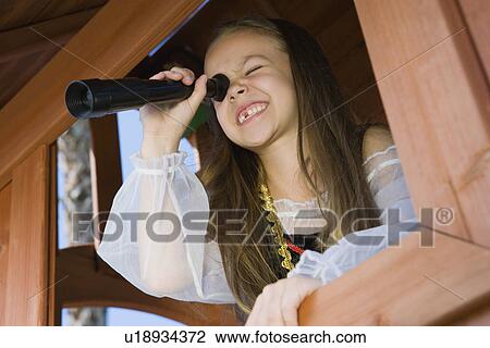 Stock Image - Little Girl Playing in a Fort. Fotosearch