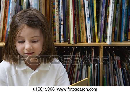Stock Photo - Little Girl Reading. Fotosearch