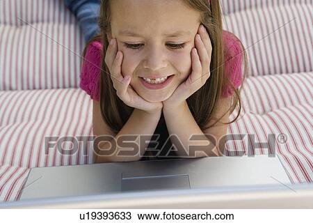 Little Girl Using a Laptop View Large Photo Image Stock Image - Little Girl Using a Laptop. Fotosearch