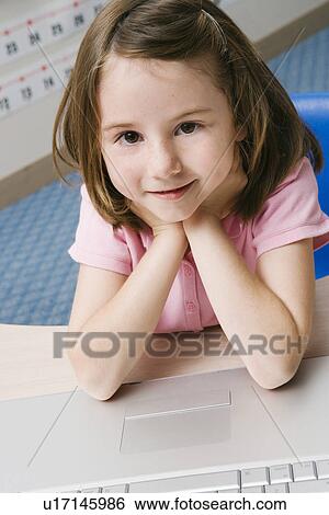 Little Girl Using a Laptop View Large Photo Image Stock Photograph - Little Girl Using a Laptop. Fotosearch
