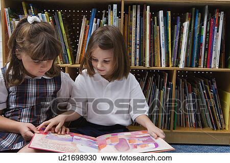 Little Girls Looking at a Picture Book View Large Photo Image Stock Image - Little Girls Looking at a Picture Book. Fotosearch