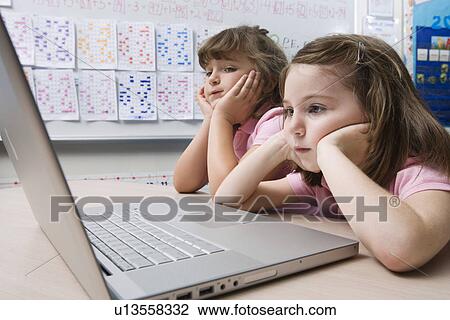 Little Girls Using a Laptop View Large Photo Image Stock Image - Little Girls Using a Laptop. Fotosearch