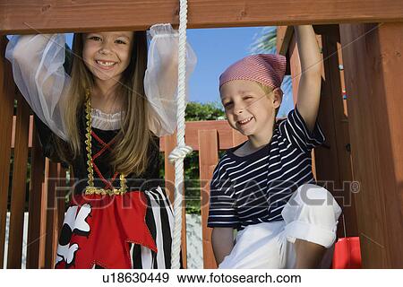 Little Kids Playing in a Tree House View Large Photo Image Stock Photo - Little Kids Playing in a Tree House. Fotosearch