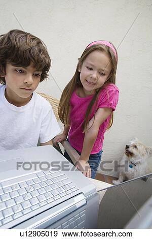 Stock Photo - Little Kids Using a Laptop. Fotosearch