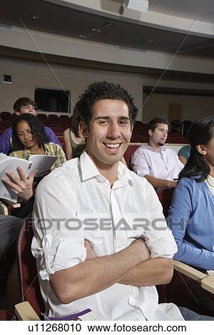 Male student sitting in class, portrait View Large Photo Image Stock Image - Male student sitting in class, portrait. Fotosearch