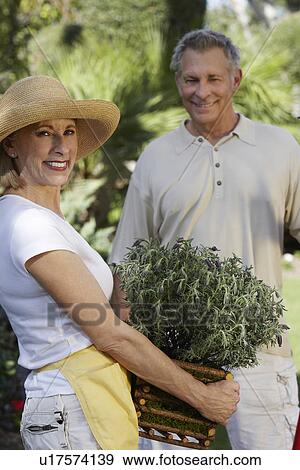Stock Photo - Man and woman gardening. Fotosearch