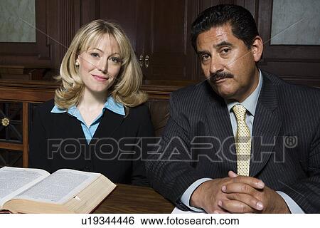 Man and woman sitting in court, portrait View Large Photo Image Stock Photograph - Man and woman sitting in court, portrait. Fotosearch