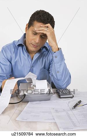Man Calculating Finances View Large Photo Image Picture - Man Calculating Finances. Fotosearch