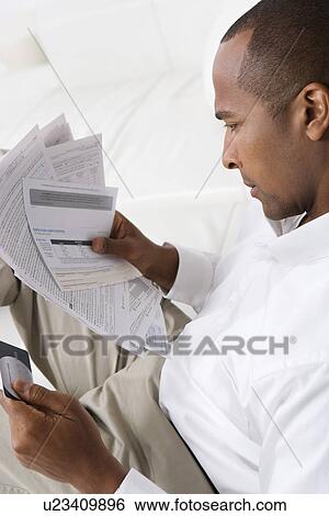 Man Checking Bills View Large Photo Image Stock Photograph - Man Checking Bills. Fotosearch