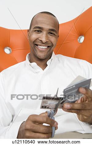 Man Cutting up Credit Cards View Large Photo Image Stock Image - Man Cutting up Credit Cards. Fotosearch