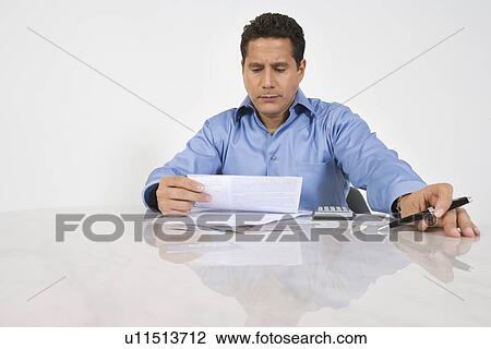 Stock Image - Man Doing Finances. Fotosearch