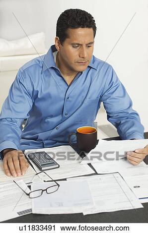 Stock Image - Man Doing Personal Finances. Fotosearch
