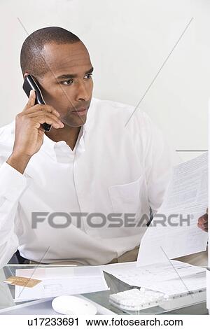 Stock Image - Man Doing Personal Finances. Fotosearch