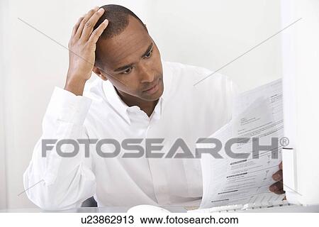 Man Doing Taxes View Large Photo Image Stock Image - Man Doing Taxes. Fotosearch