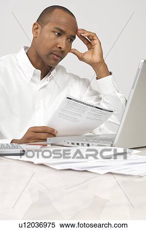 Man Doing Taxes View Large Photo Image Stock Photography - Man Doing Taxes. Fotosearch