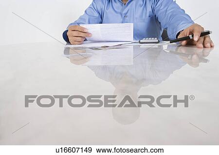 Stock Photo - Man Figuring out Bills. Fotosearch