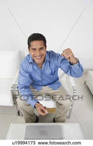 Stock Image - Man Holding Credit Card. Fotosearch