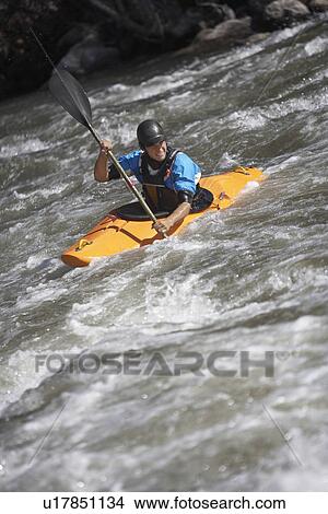 Man kayaking in mountain river View Large Photo Image Picture - Man kayaking in mountain river. Fotosearch