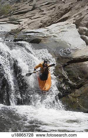 Stock Photo - Man kayaking in mountain river. Fotosearch