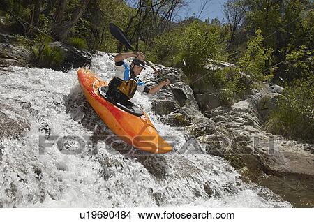 Man kayaking on mountain river View Large Photo Image Picture - Man kayaking on mountain river. Fotosearch