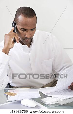Man Paying Bills View Large Photo Image Stock Photo - Man Paying Bills. Fotosearch