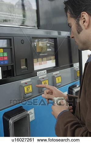 Man pushing buttons on gas pump View Large Photo Image Stock Image - Man pushing buttons on gas pump. Fotosearch