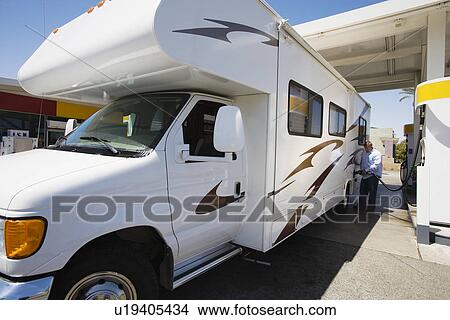 Man Refueling RV View Large Photo Image Picture - Man Refueling RV. Fotosearch