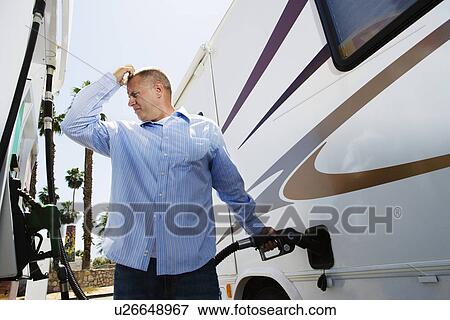 Man Refueling RV View Large Photo Image Stock Photo - Man Refueling RV. Fotosearch
