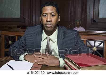 Stock Image - Man sitting in court, portrait. Fotosearch