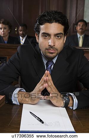 Stock Photography - Man sitting in court, portrait. Fotosearch