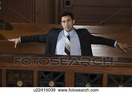 Stock Photo - Man sitting in court. Fotosearch