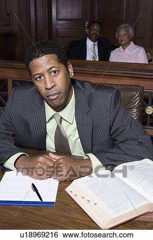 Man sitting in court View Large Photo Image Stock Photograph - Man sitting in court. Fotosearch