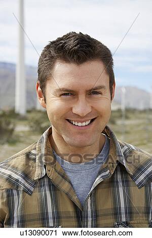 Man smiling, outdoors, portrait View Large Photo Image Stock Image - Man smiling, outdoors, portrait. Fotosearch