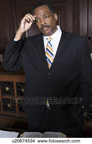 Picture - Man standing in court. Fotosearch